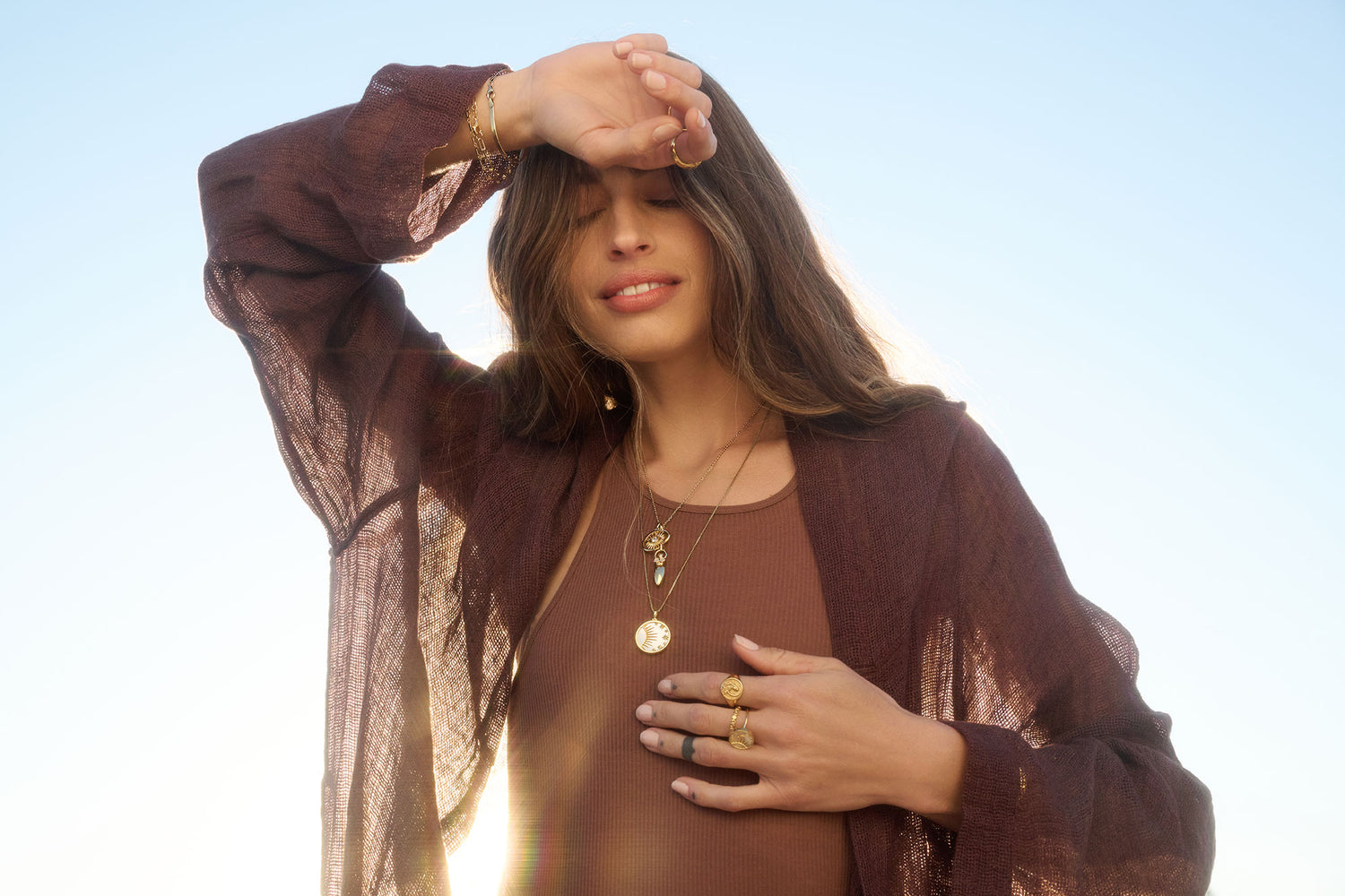 Model wearing Moonstone goddess necklace and celestial mother of pearl necklace