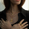 A woman wearing the Awe Inspired Collector Necklace with a Special Edition Hecate pendant in gold vermeil