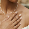 Model is shown with Double Moonstone Ring and Pearl Ring.