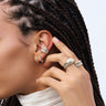 Awe Model is wearing Eternal Milgrain Rings with Diamond Triple Moon Band, Starry Night Ring with White Sapphire Ear Cuff, Small Diamond Huggie Earring and Diamond Ray Huggie Earring.