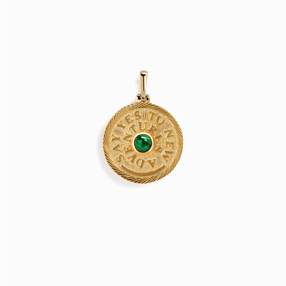 Product image of A Say Yes to New Adventures Affirmation Coin Pendant by Awe Inspired with an emerald stone.