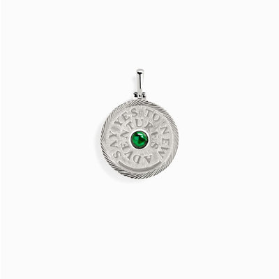 An Awe Inspired Say Yes to New Adventures Affirmation Coin Pendant with an emerald stone.