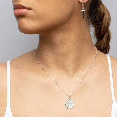 Model wearing Teardrop Ala necklace with gemstone on cable chain in sterling silver