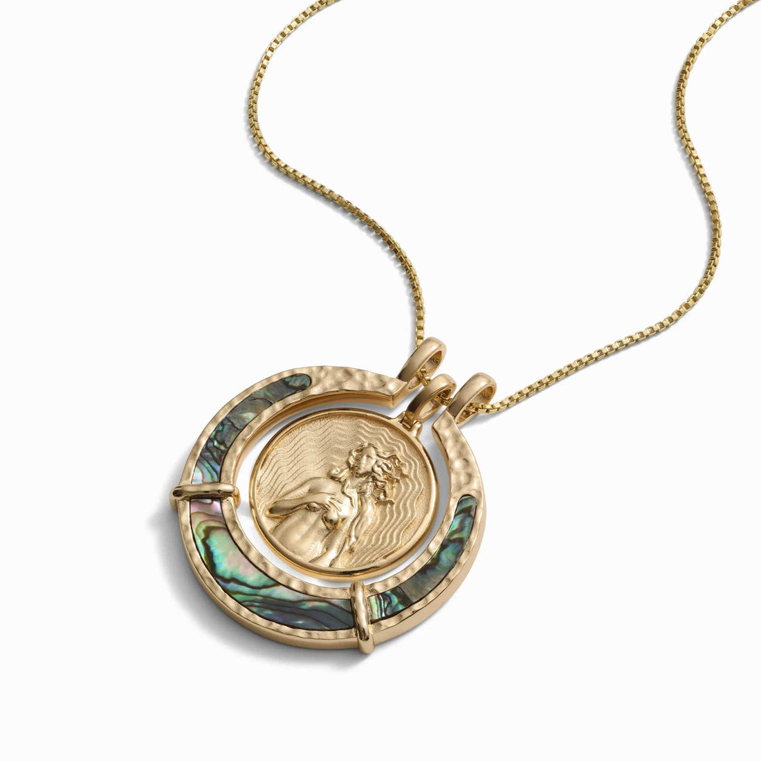 A 14k gold vermeil chain showcasing the Awe Inspired Abalone Goddess Halo, with an intricate figure encircled by iridescent abalone shell inlays.