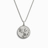 The Athena Necklace by Awe Inspired is a silver piece featuring a round pendant with an engraved figure of Athena, adorned with decorative patterns symbolizing wisdom and courage.