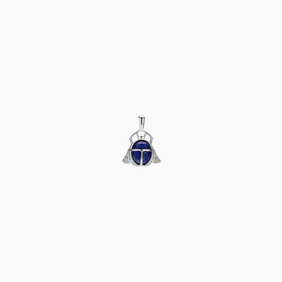 An Awe Inspired Lapis Lazuli Scarab Amulet with a blue stone on it.