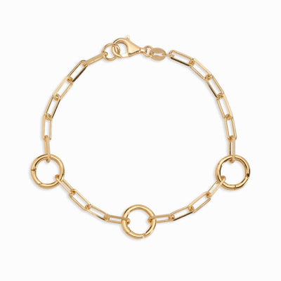 An Awe Inspired gold chain bracelet with three amulet links, called The Collector Bracelet in gold vermeil.