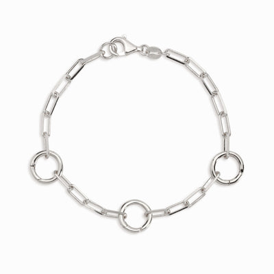An Awe Inspired gold chain bracelet with three amulet links, called The Collector Bracelet in sterling silver