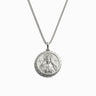 Awe Inspired's Brigid Necklace is a silver necklace with a round pendant featuring an engraved image of Brigid, the triple deity, adorned in a crown and robe.