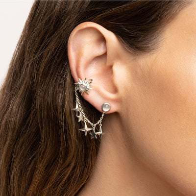 Model wearing a single Sun, Moon & Stars Ear Swag with moonstone cabochon in sterling silver