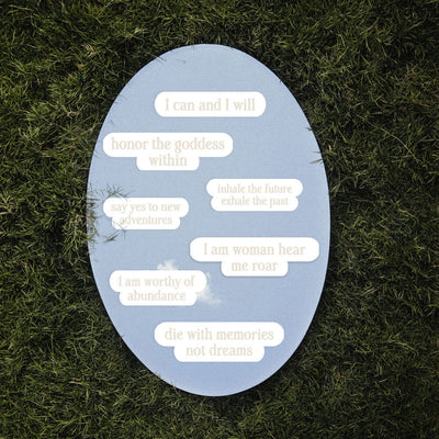 An Awe Inspired Affirmation Decal in the grass.