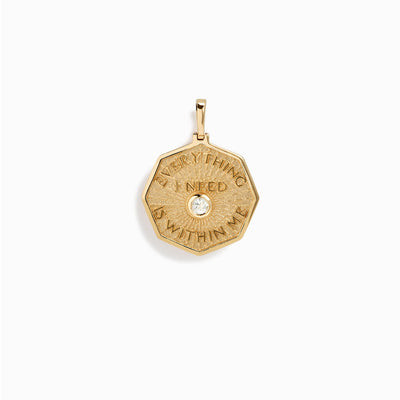An Everything I Need is Within Me Affirmation Coin Pendant by Awe Inspired with a diamond on it.