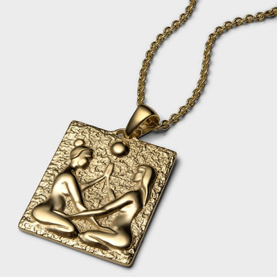 An Embrace Tablet necklace with a woman and a man on it by Awe Inspired.
