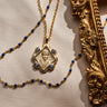 Queen Esther Pendant with a border of blue sapphires paired with a Navy colored enamel necklace in gold vermeil