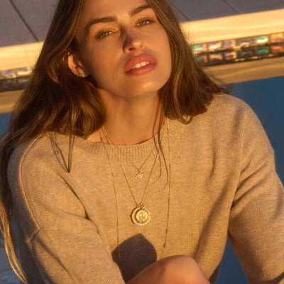 White Topaz Goddess Halo and 20mm Selene Goddess coin necklace in gold vermeil on a cable chain. Model also wearing Triple Moon necklace on a saturn chain. 