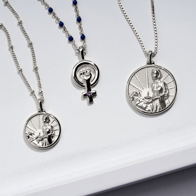 Three Florence Nightingale Pendants with the image of st jesus on them by Awe Inspired.