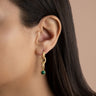 Model wearing Malachite Twisted Drop Earrings in gold vermeil