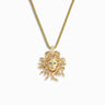 The Special Edition Medusa Necklace by Awe Inspired features a gold pendant with a sculpted Medusa head, adorned with emerald eyes, symbolizing protection against Medusa's gaze.