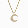 Presenting the Twisted Moon Necklace by Awe Inspired: a stunning gold piece featuring a crescent moon pendant, with one half elegantly adorned in small white topaz crystals, all against a pristine white background.