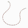 An Awe Inspired red and silver beaded anklet made of colored enamel on a white background.