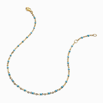 An Awe Inspired Colored Enamel Anklet with turquoise beads.