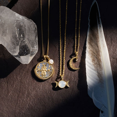 Diamond Moon Amulet paired with Special Edition Hecate pendant and Triple Moon amulet  in gold vermeil