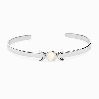 An Awe Inspired Triple Moon Cuff bracelet with a white stone.
