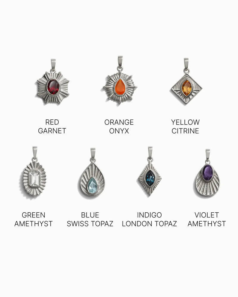 An image displaying eight unique gemstone pendants, each labeled: Red Garnet, Orange Onyx, Yellow Citrine, Green Amethyst, Blue Swiss Topaz, Indigo London Topaz, and Violet Amethyst. These Chakra Pendants are the perfect addition to your Invisible Aura Charm Bracelet by Awe Inspired or to complement your Watchful Moon Eye accessory.