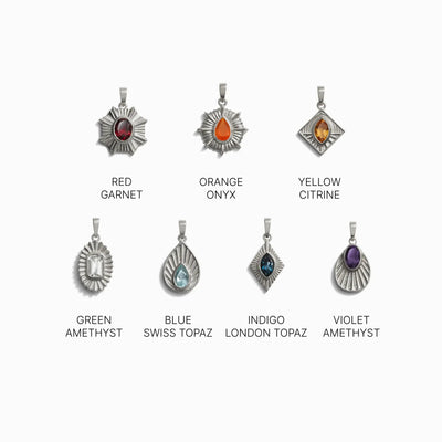 An image displaying eight unique gemstone pendants, each labeled: Red Garnet, Orange Onyx, Yellow Citrine, Green Amethyst, Blue Swiss Topaz, Indigo London Topaz, and Violet Amethyst. These Chakra Pendants are the perfect addition to your Invisible Aura Charm Bracelet by Awe Inspired or to complement your Watchful Moon Eye accessory.