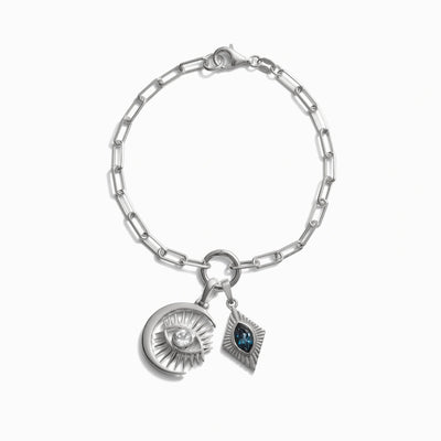 Invisible Aura Charm Bracelet by Awe Inspired, featuring a watchful moon eye pendant, chain link design, and lobster clasp closure.