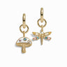 Two gold charms: one shaped like a magic mushroom adorned with colorful stones, and the other shaped like a lucky dragonfly with multicolored gemstones, each attached to a gold hoop. These enchanting pieces are part of the Forest Fairy Charm Earrings collection by Awe Inspired.