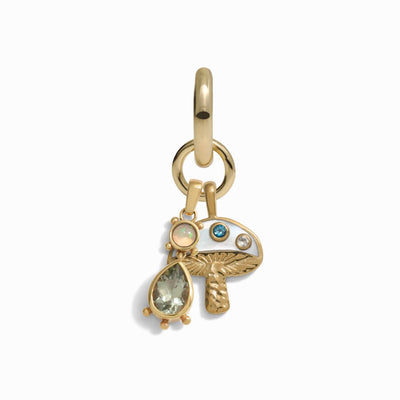 Awe Inspired's Magic Mushroom Single Charm Earring features a gold charm adorned with an array of small gemstones, including a pearl, a green gem, and a blue gem.