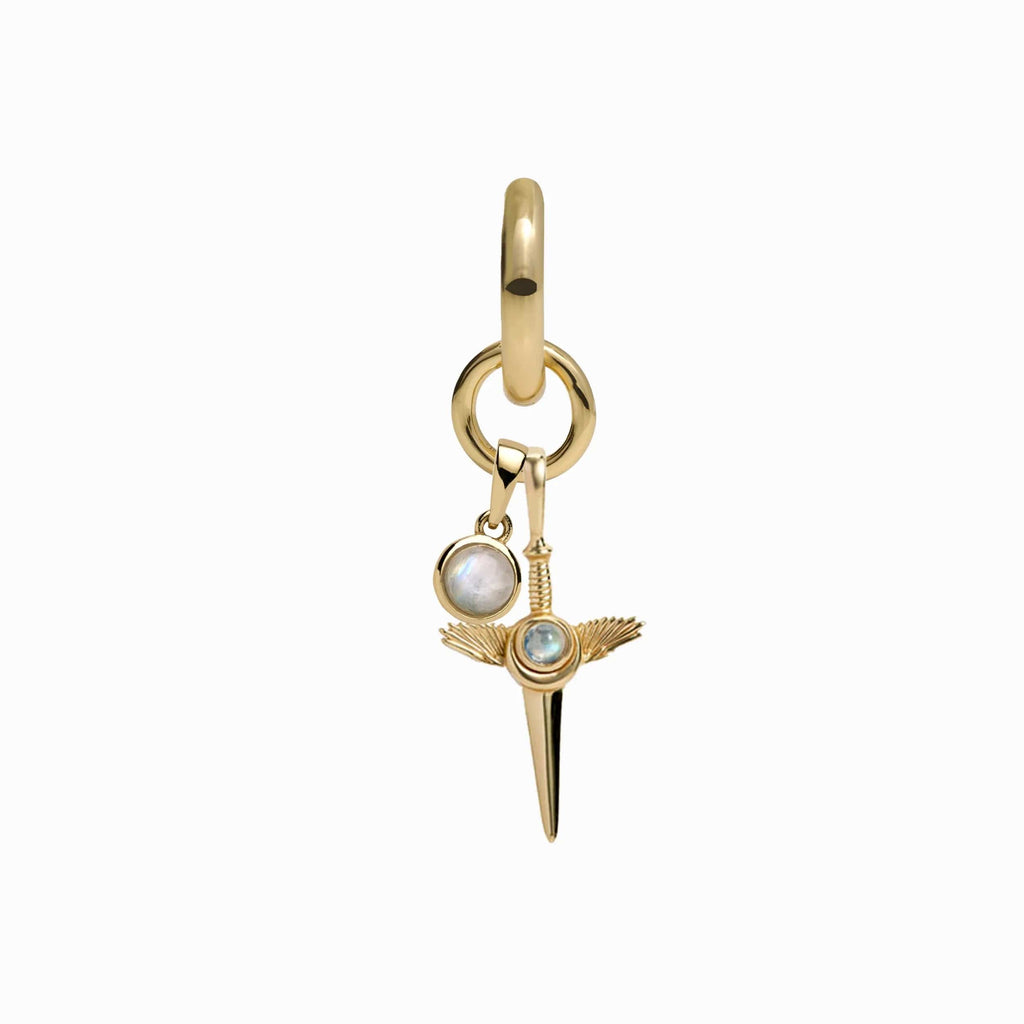 The Blood Moon Rising Charm Earrings by Awe Inspired feature a gold pendant with spike and winged details, as well as a smaller rainbow moonstone amulet adorned with a circular gemstone.
