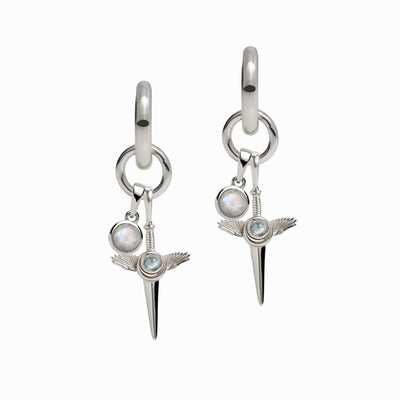 Blood Moon Rising Charm Earrings by Awe Inspired featuring silver hoops with dangling wing charms and round Rainbow Moonstone amulets.