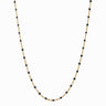 The Awe Inspired Chain Necklace, featuring small black beads evenly spaced along the gold chain, is perfect for effortlessly changing your look.