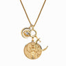 A gold necklace with multiple charms including a sun with an eye, an etched round medallion, and a crescent moon adorned with a small sparkling gem, resembling the mystical Hecate Pendant and hinting at hidden psychic powers can be found in the Dancing in the Moonlight Charm Necklace by Awe Inspired.