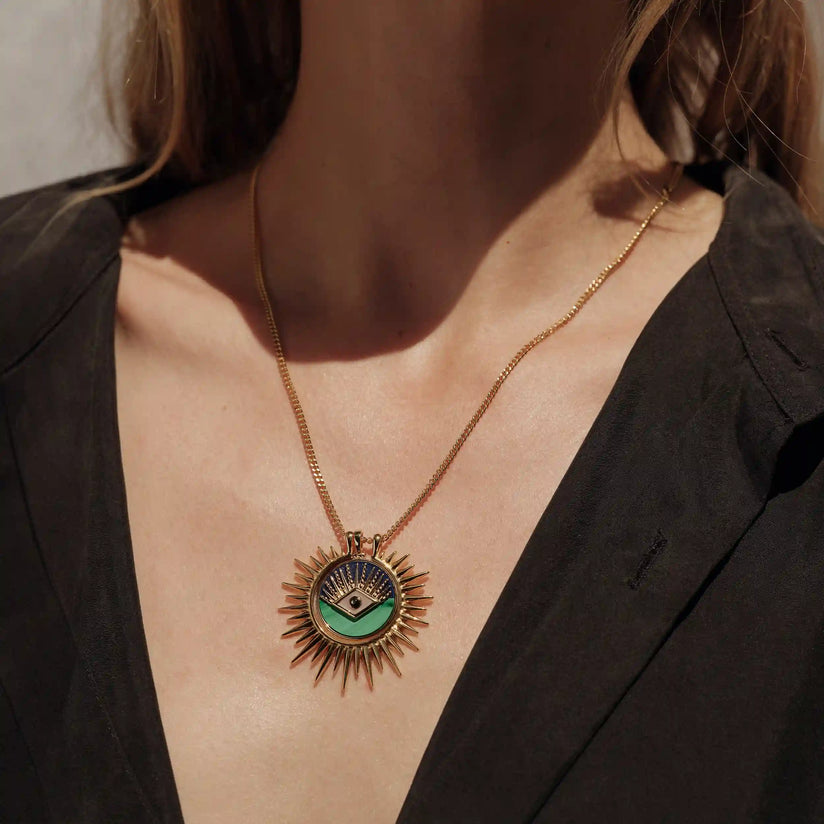 Phoebe- offers coral necklace with eye pendant