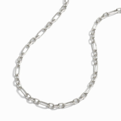 The Statement Chain Necklace by Awe Inspired features elongated oval links arranged in a continuous pattern, making it perfect for a stylish necklace stack.