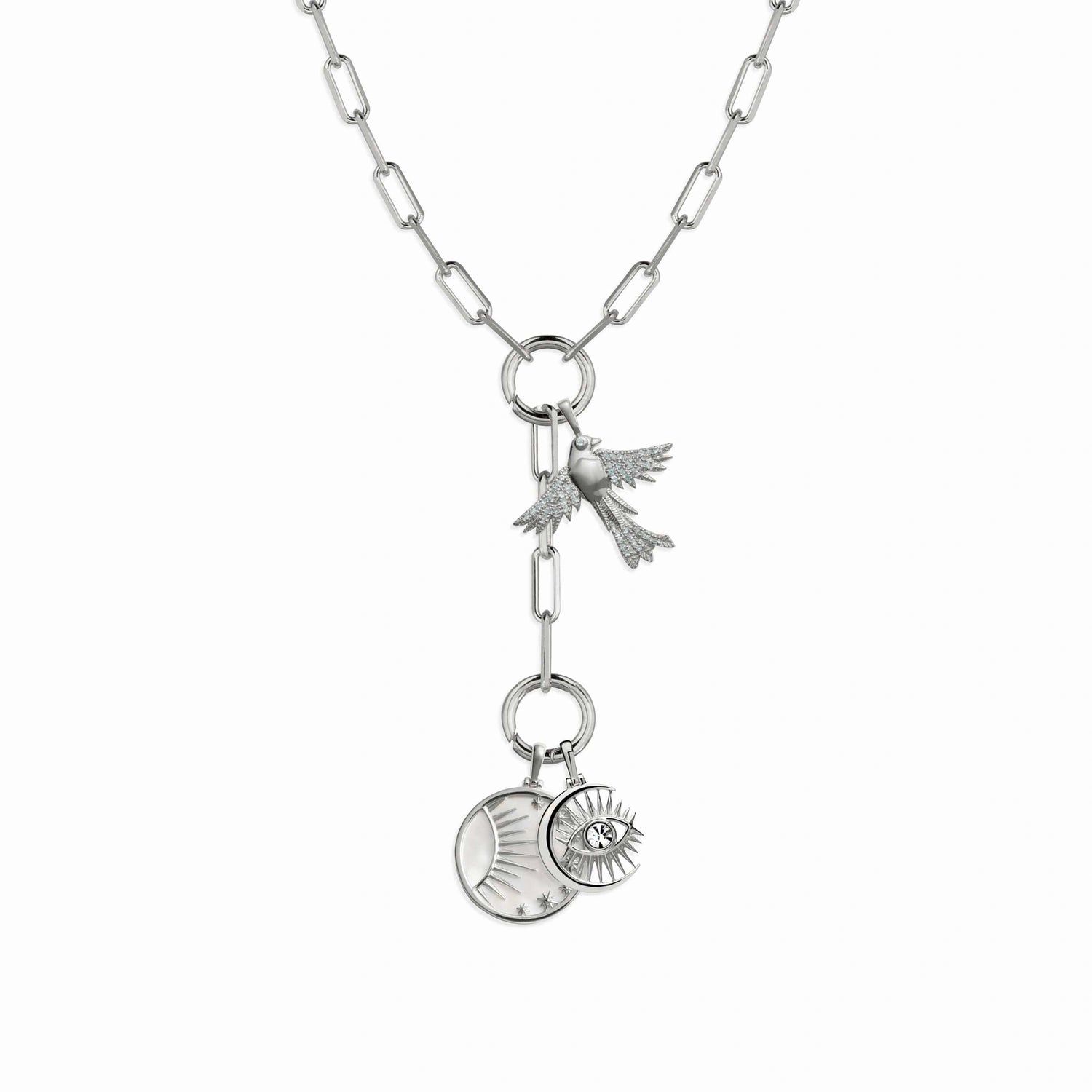 Product image of Blue Sky Charm Lariat by Awe Inspired featuring a bird charm and two circular pendants, one with a sun and crescent design, and the other with an eye and star design.