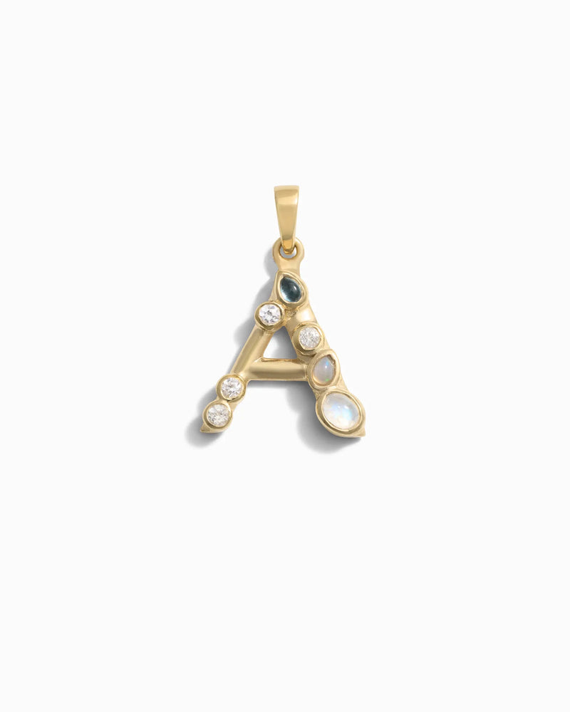 Awe Inspired's Gemstone Initial Pendant featuring a gold letter "A" adorned with bezel set gemstones, including pearls and diamonds, against a white background.