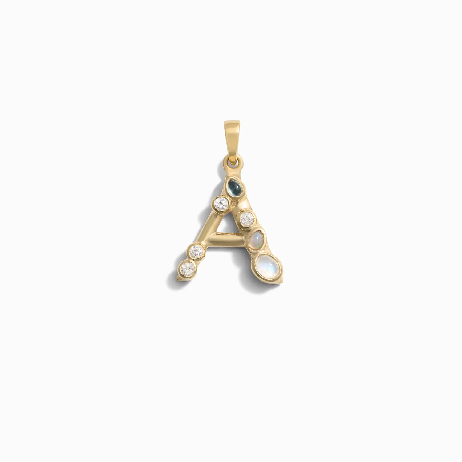 Product image of Awe Inspired's Gemstone Initial Pendant featuring a gold letter "A" adorned with bezel set gemstones, including pearls and diamonds, against a white background.
