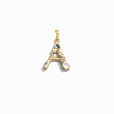 Awe Inspired's Gemstone Initial Pendant featuring a gold letter "A" adorned with bezel set gemstones, including pearls and diamonds, against a white background.