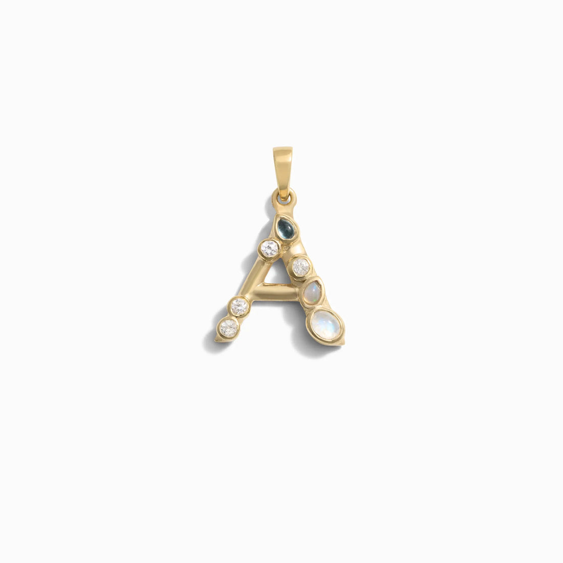 Awe Inspired's Gemstone Initial Pendant featuring a gold letter "A" adorned with bezel set gemstones, including pearls and diamonds, against a white background.