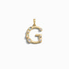 The Gemstone Initial Pendant by Awe Inspired is a gold pendant shaped like the letter "G," adorned with small round and oval bezel set gemstones, crafted as a unique piece of personalized jewelry.