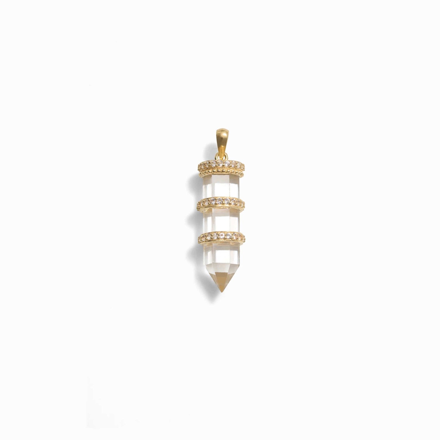 Product image of Awe Inspired's Manifestation Crystal Amulet is a stunning gold and crystal pendant featuring a faceted, clear quartz encased in gold rings, ending in a pointed tip. This elegant piece has a small gold loop at the top for attaching to a chain.