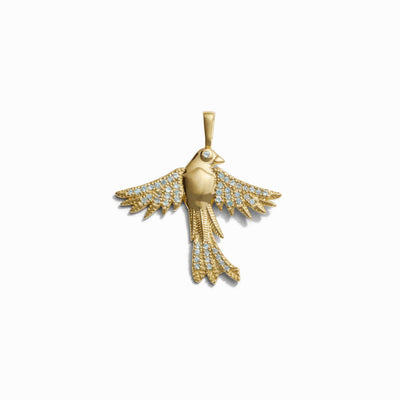 The Suffragist Bluebird Amulet by Awe Inspired is a gold pendant sculpted in the form of a bird with outstretched wings, embellished with small diamonds on its wings and tail, evoking the imagery of a Bluebird taking flight.