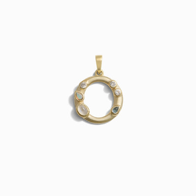 The Gemstone Initial Pendant by Awe Inspired is a stunning gold circular piece that features three small opal stones, two small diamonds, and one larger diamond arranged around the ring in a bezel setting. This exquisite pendant is ideal for those who appreciate personalized jewelry.