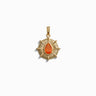 The Aura Pendant by Awe Inspired is a gold pendant with a sunburst design, featuring a central teardrop-shaped orange gemstone that enhances your aura.