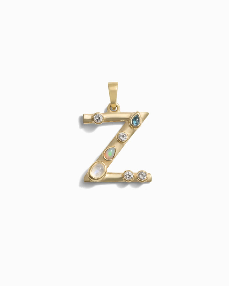 Awe Inspired's Gemstone Initial Pendant featuring a gold letter "Z" adorned with bezel-set opals and diamonds on a white background.