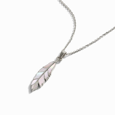 Awe Inspired's Mother of Pearl Feather Amulet is a silver necklace featuring a delicate pendant shaped like a feather with iridescent detailing, reminiscent of Athena's power, suspended from a fine chain.